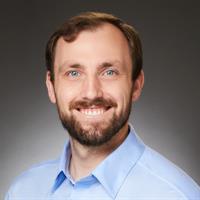 portrait of Justin M Burns, PAC